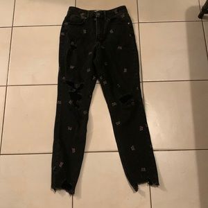 black mom jeans with orange butterfly’s